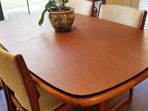 Round-sided rectangular cherry wood dining table protector pad