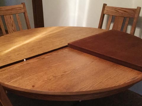 Round dining table protector with folding sections