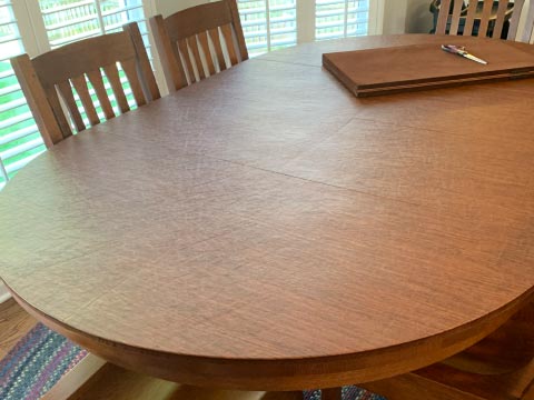 Oval dining table protector pad, in oak woodgrain