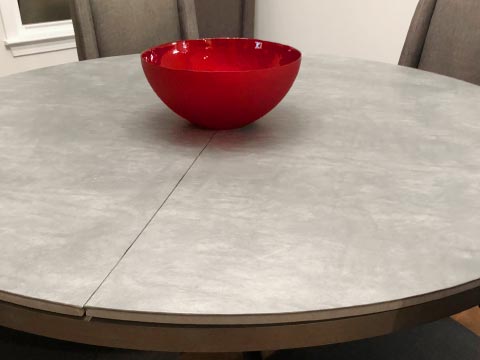 Gray leatherlook round table protector pad