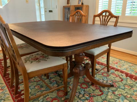 Rectangular dining table protector pad with round corners