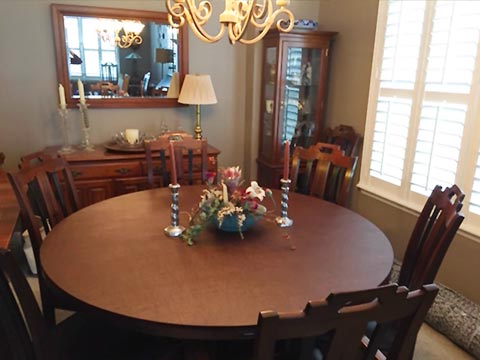 Round dining table protector pad under centerpiece