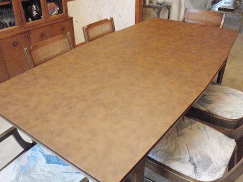 Tapering dining room table protector photo