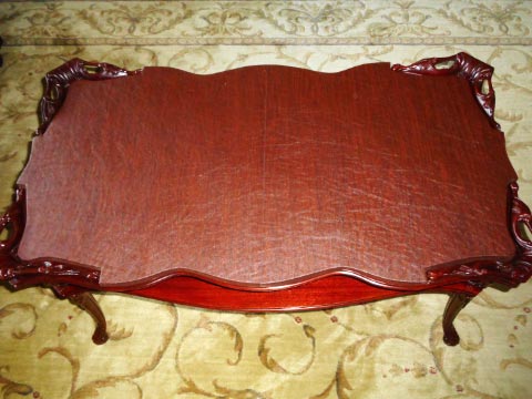 Custom-shaped coffee table protector photo with scalloped edges