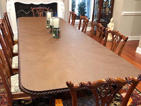 Protector for dining room table with carved edge