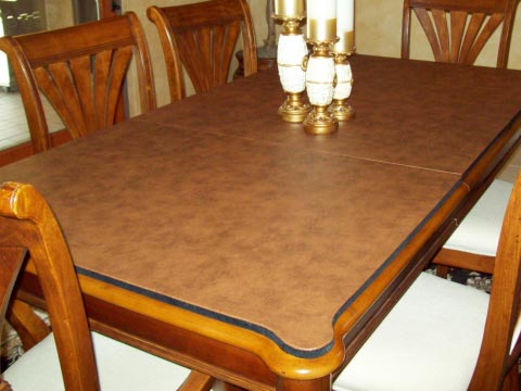 Table protector pad with custom shaped corners