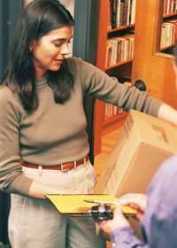 Photo: woman accepting delivery of package