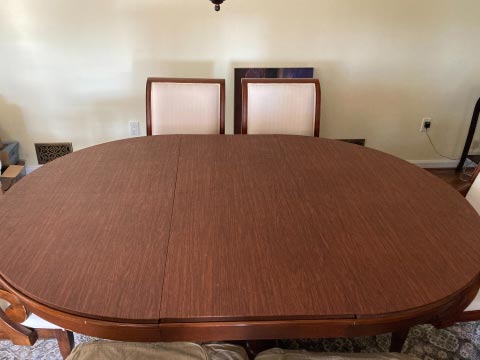 Rounded dining table pad with leaf