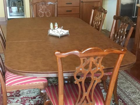 Round-cornered cherry wood dining table protector