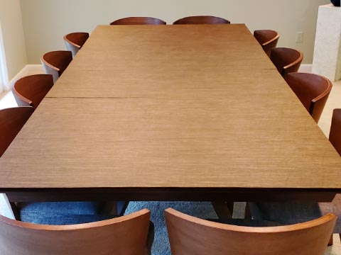 Rectangle-shaped table protector pad in oak woodgrain