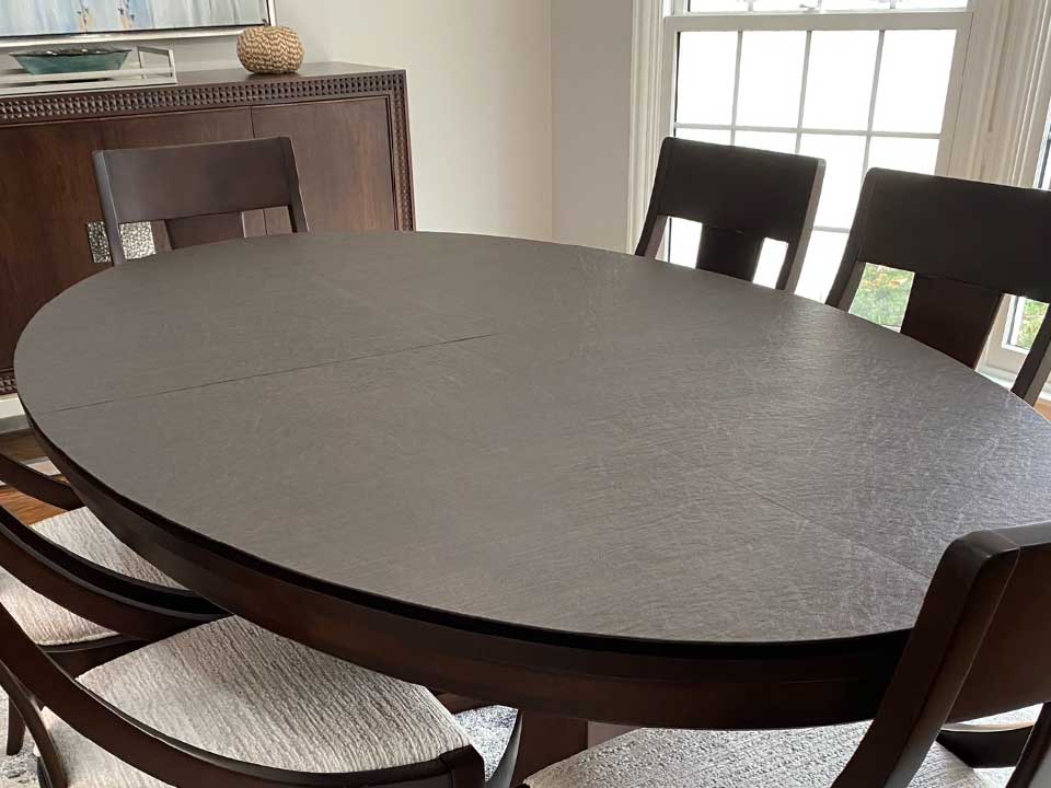 Elliptical dining table protector pad