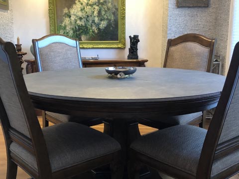 Circular grey dining table protector pad