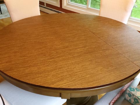 Circular dining table protector pad, in pecan woodgrain