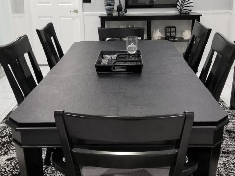 Black dining room table pad with truncated corners